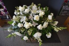Casket spray in all white with Lilies