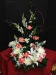 Funeral Flowers Around the Urn with Pink Roses
