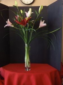 Lily Flowers in a tall slim vase